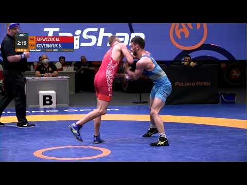 BRONZE GR - 67 kg: M. SZEWCZUK (POL) v. B. KOVERNYUK (UKR) background