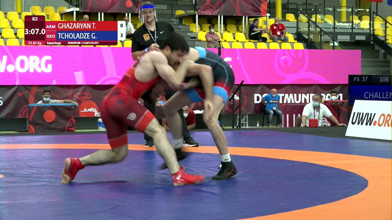 Repechage FS - 65 kg: T. GHAZARYAN (ARM) v. G. TCHOLADZE (GEO) background