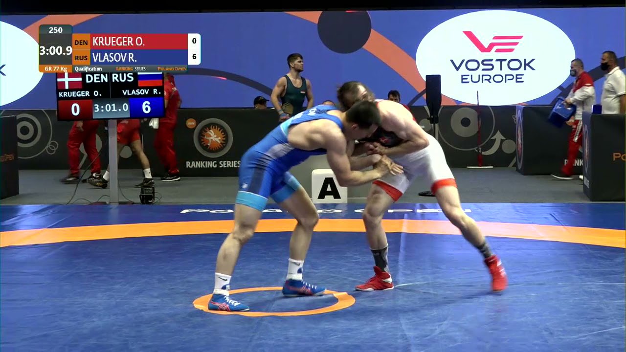 Qual. GR - 77 kg: O. KRUEGER (DEN) v. R. VLASOV (RUS) background
