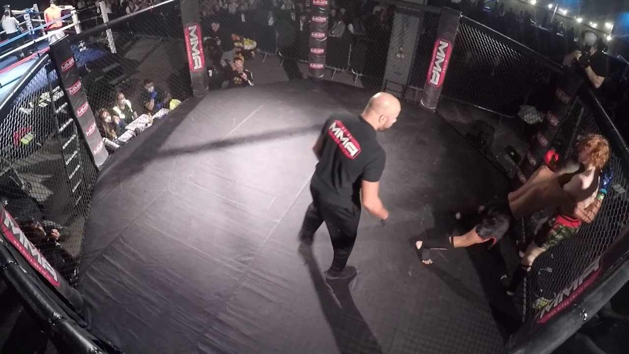 Fight 2 UMMA Matt Quinn V Tayaab Muay Thai Murray background