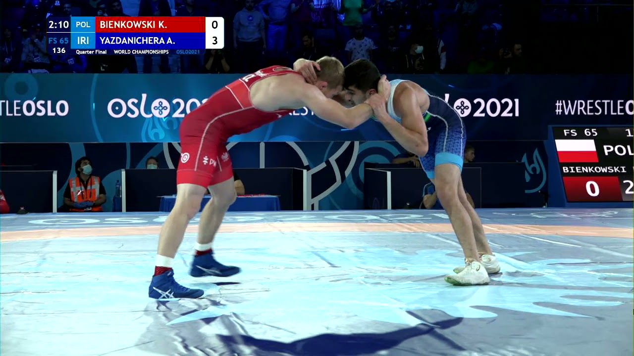 1/4 FS - 65 kg: K. BIENKOWSKI (POL) v. A. YAZDANICHERA (IRI) background