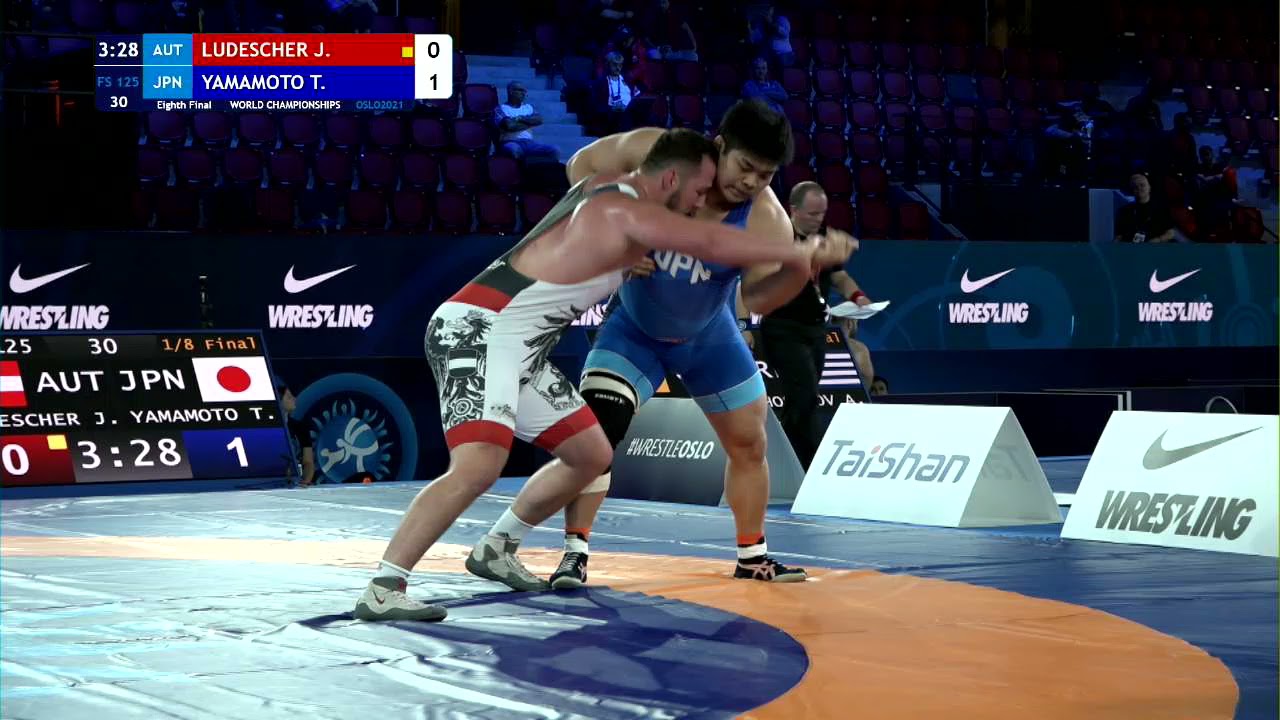 1/8 FS - 125 kg: J. LUDESCHER (AUT) v. T. YAMAMOTO (JPN) background