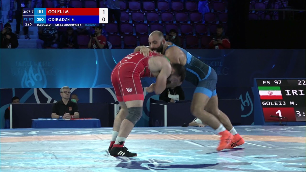 Qual. FS - 97 kg: M. GOLEIJ (IRI) v. E. ODIKADZE (GEO) background