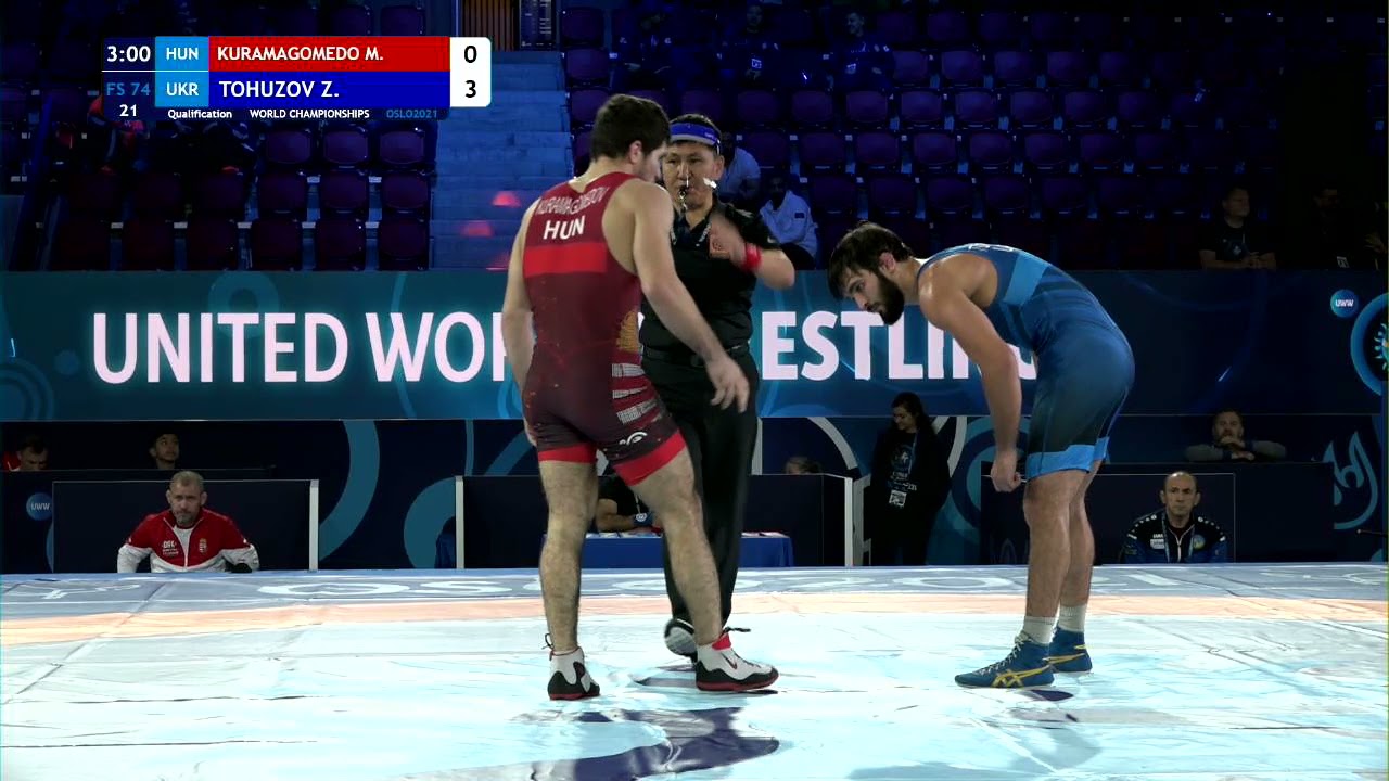 Qual. FS - 74 kg: M. KURAMAGOMEDO (HUN) v. Z. TOHUZOV (UKR) background
