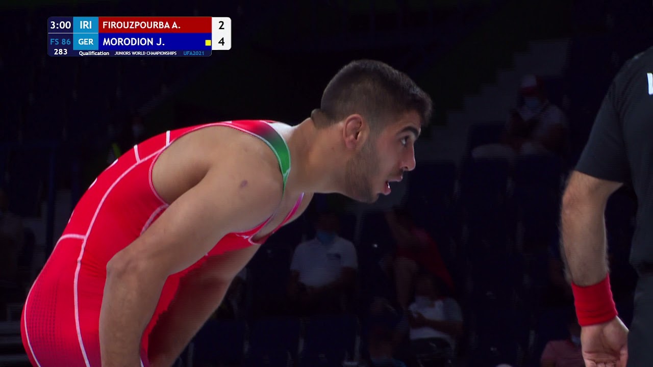 Qual. FS - 86 kg: A. FIROUZPOURBA (IRI) v. J. MORODION (GER) background