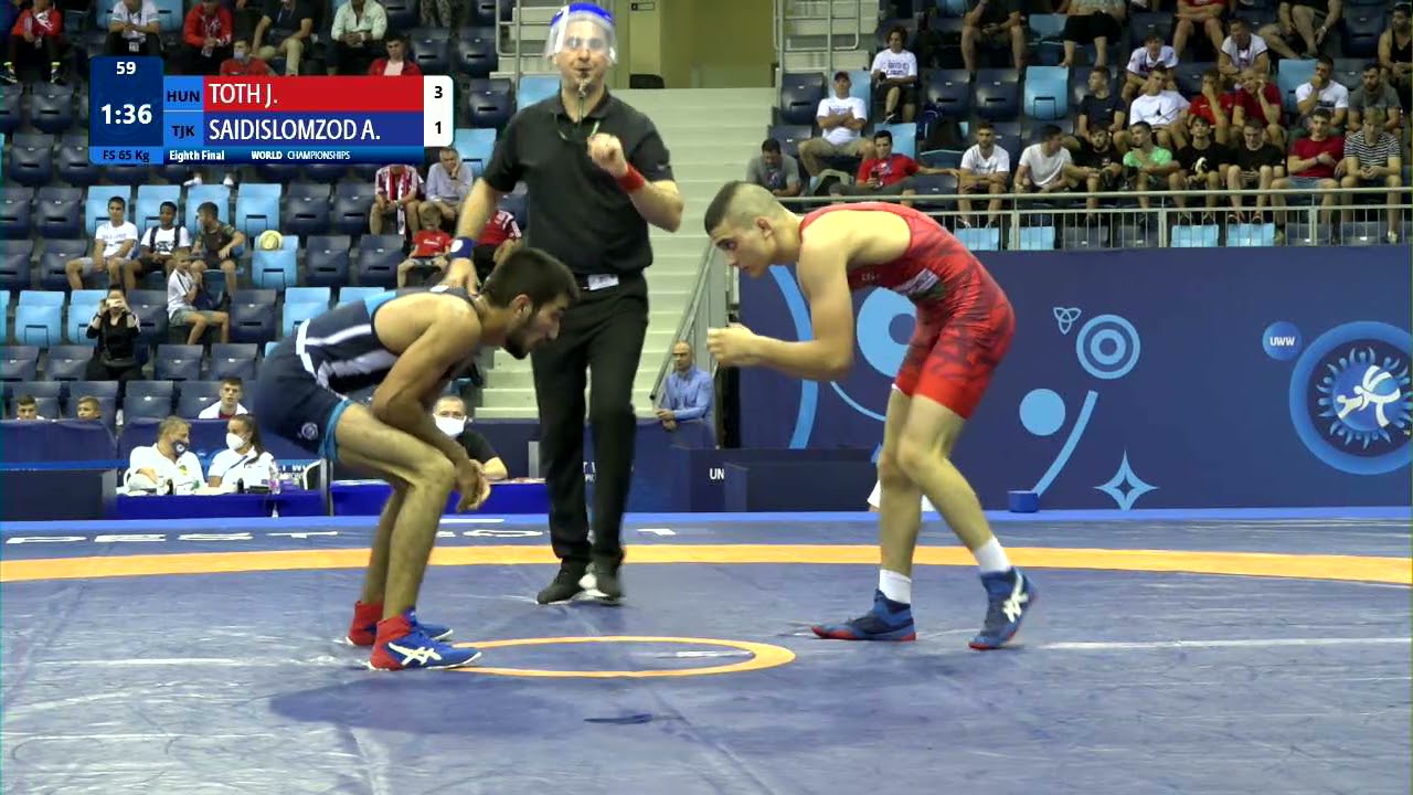 1/8 FS - 65 kg: J. TOTH (HUN) v. A. SAIDISLOMZOD (TJK) background