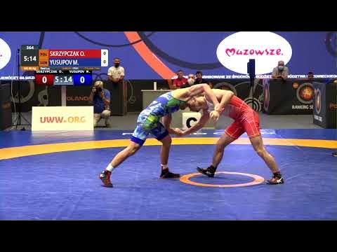 BRONZE GR - 60 kg: O. SKRZYPCZAK (POL) v. M. YUSUPOV (UZB) background