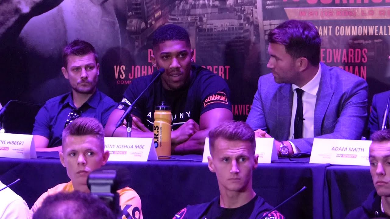 I'll kick your a** again you little punk | Big clash at Anthony Joshua Press Conference background