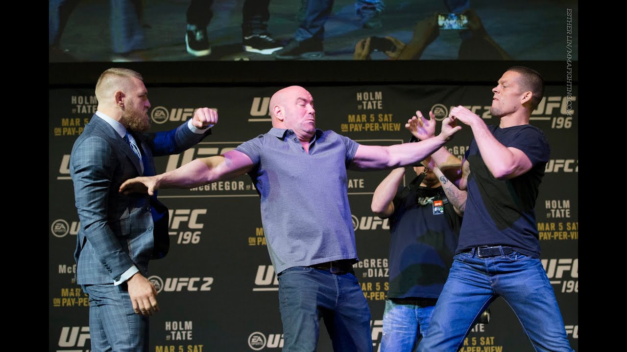 UFC 196: Conor McGregor, Nate Diaz Almost Scuffle After Staredown background