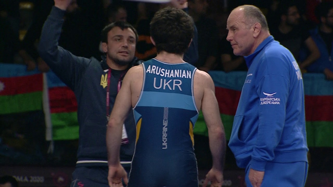 1/2 FS - 65 kg: K. SHIRAEV (RUS) v. E. ARUSHANIAN (UKR) background