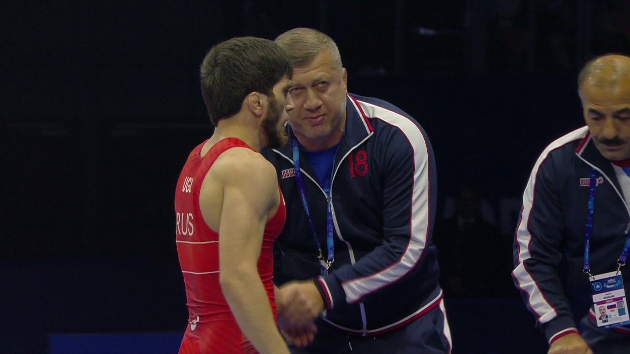 1/2 FS - 57 kg: Z. UGUEV (RUS) v. Y. TAKAHASHI (JPN) background