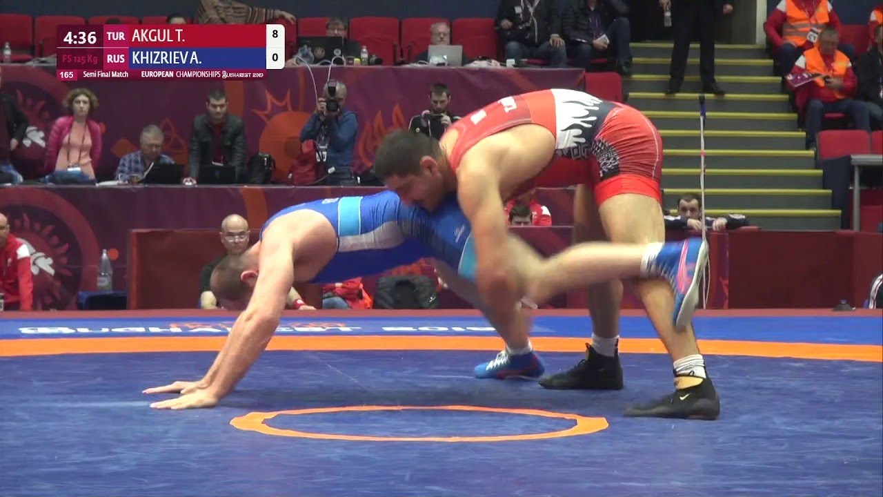 1/2 FS - 125 kg: T. AKGUL (TUR) v. A. KHIZRIEV (RUS) background