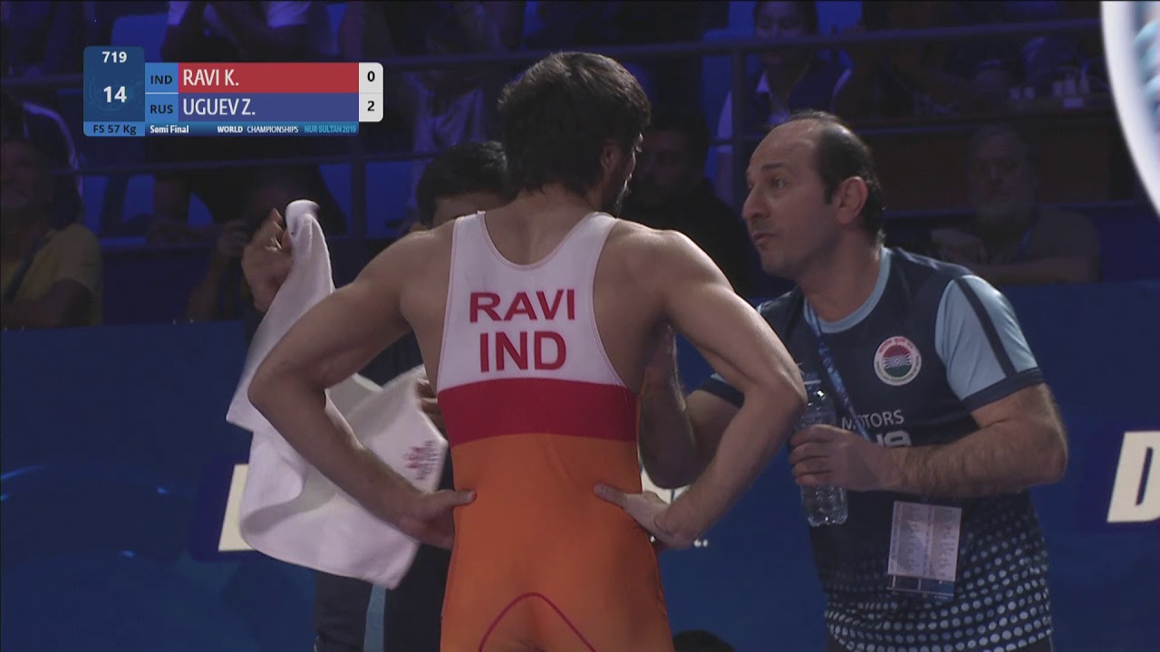 1/2 FS - 57 kg: K. RAVI (IND) v. Z. UGUEV (RUS) background