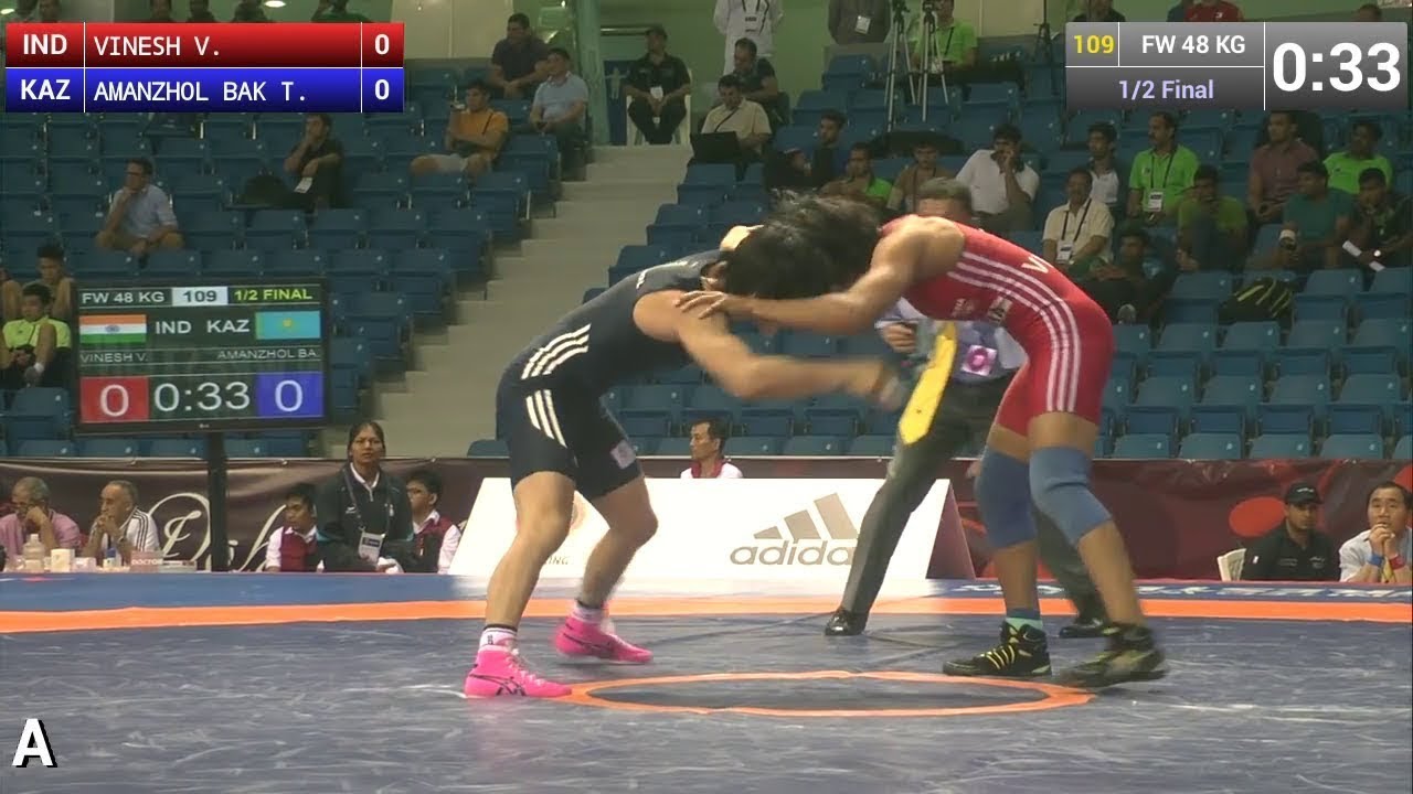 V. VINESH (IND) df. T. AMANZHOL BAK (KAZ) | FW 48 kg | 1/2 background