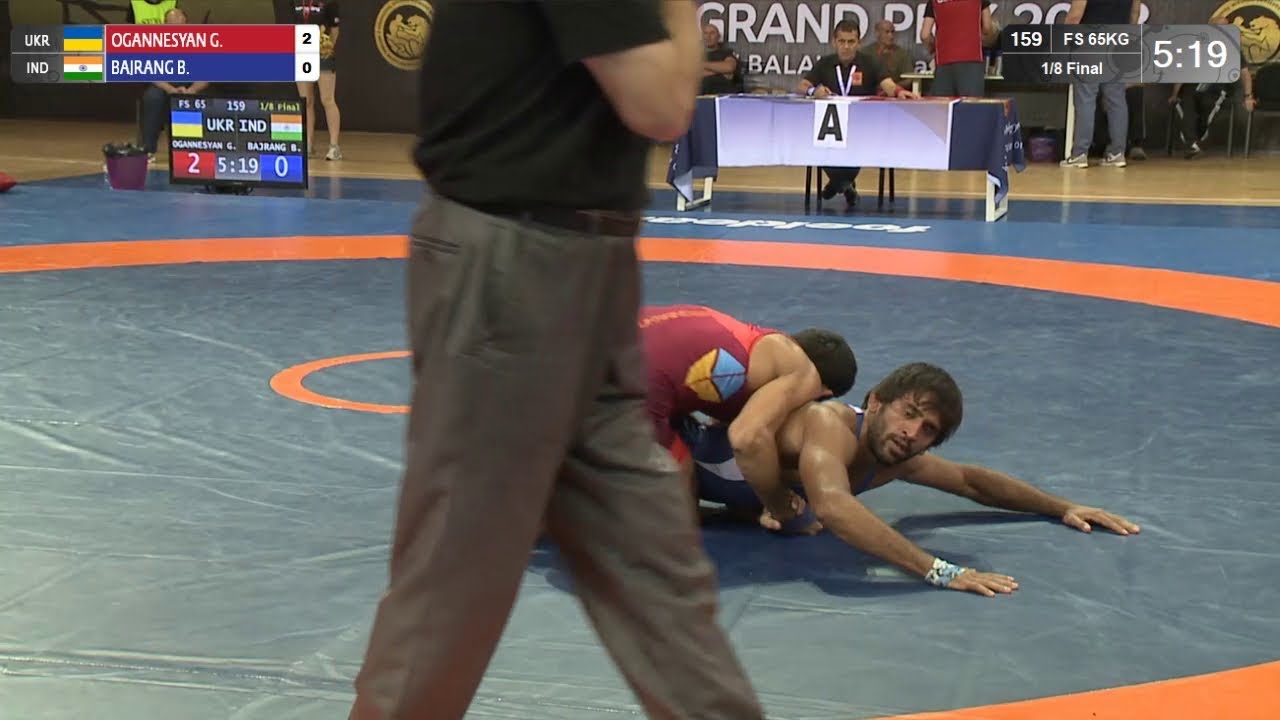1/8 FS - 65 kg: G. OGANNESYAN (UKR) v. B. BAJRANG (IND) background
