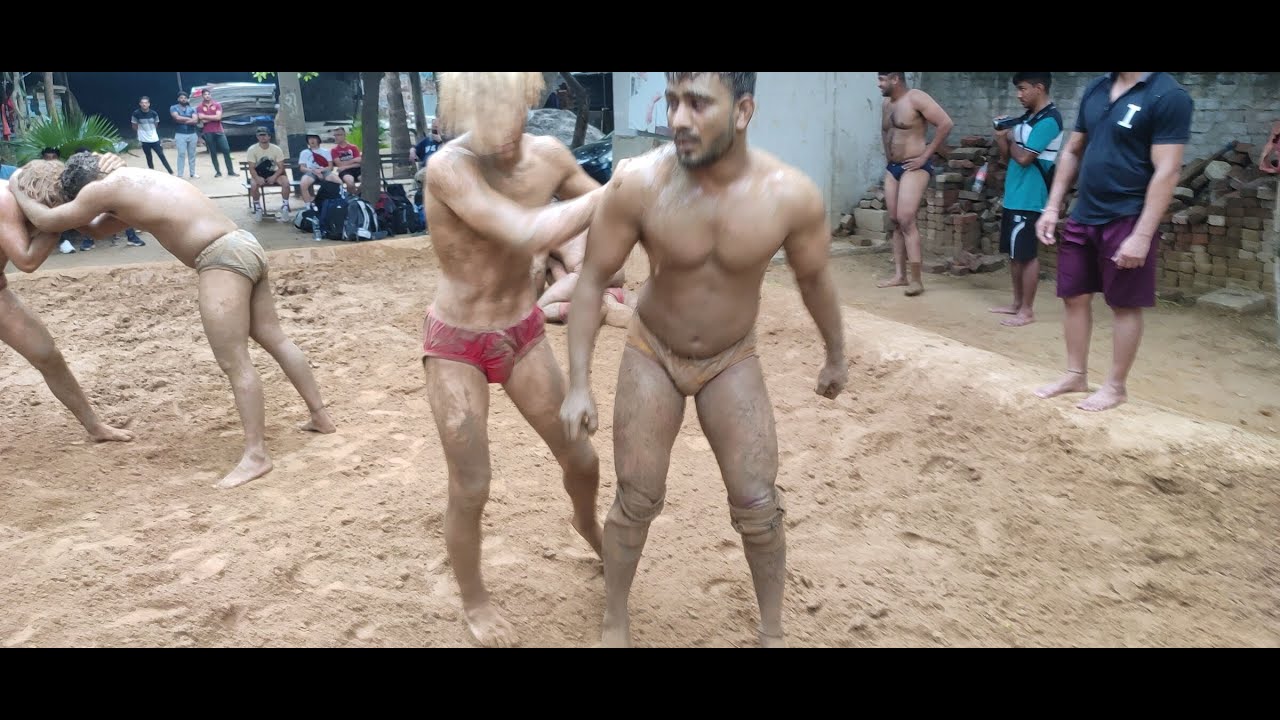 USA, Indian wrestelers practice Desi Kushti at Guru Jasram Akhada, New Delhi, India