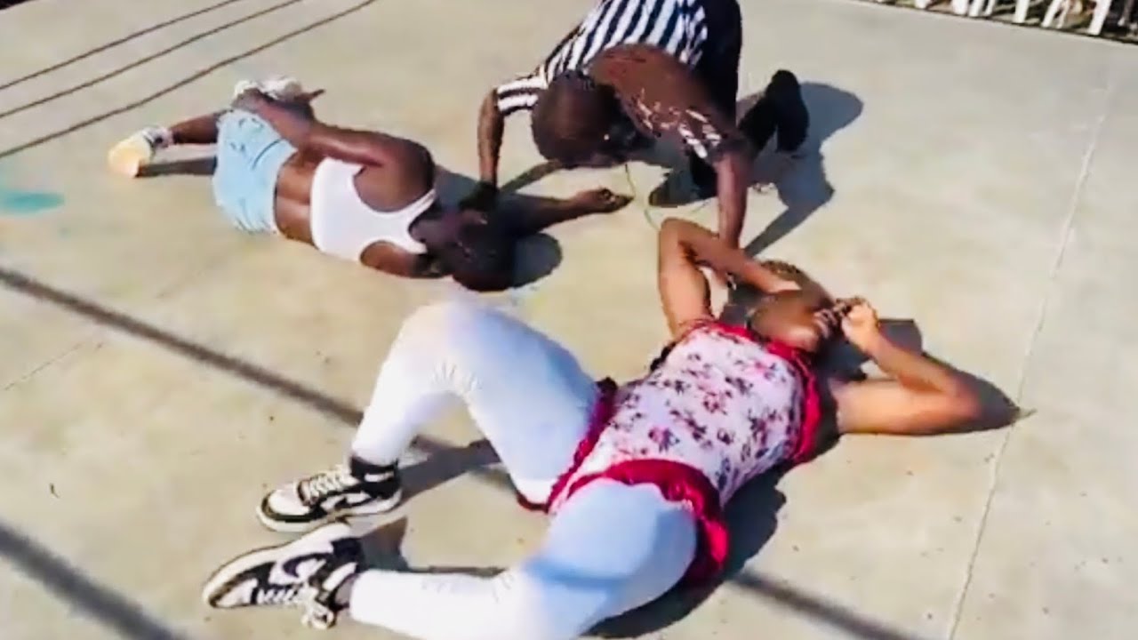 African WWE Women Wrestling at Softground mud wrestling Uganda background