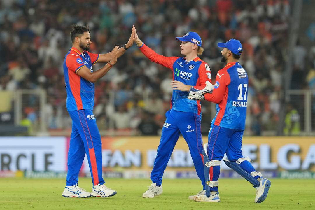 Mukesh Kumar's incisive spell of 3/14 background