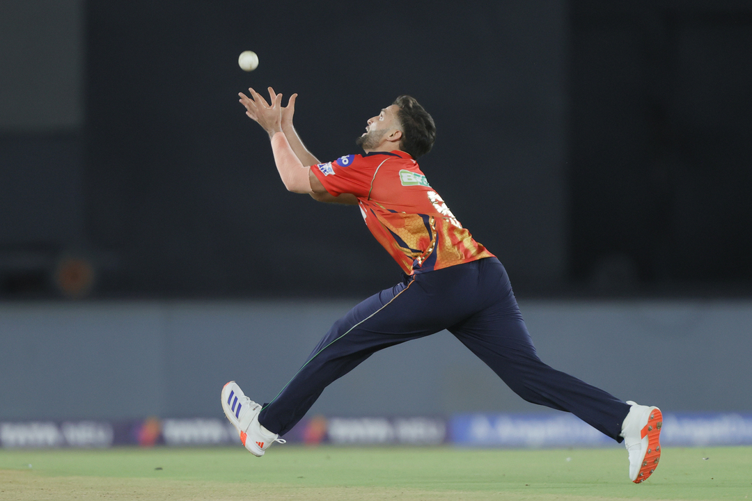 Big wicket. Fantastic catch: Omarzai does it all by himself background