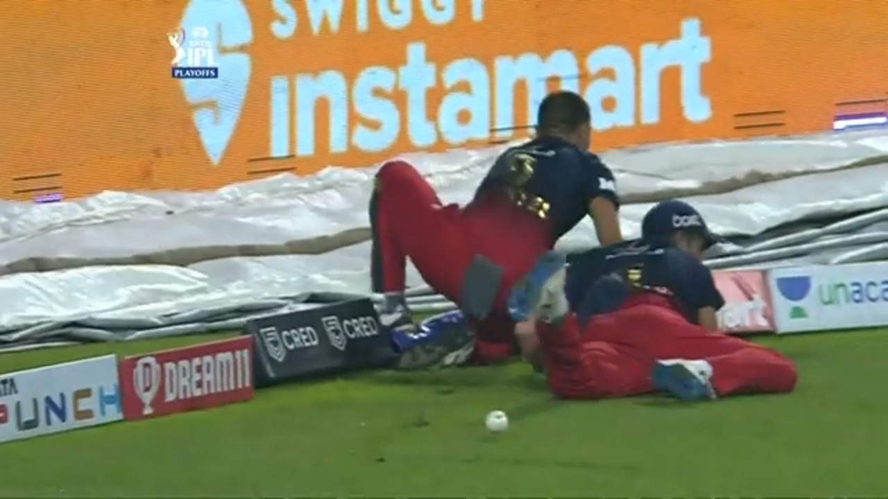 OUCH: Lomror crashes into Harshal Patel's ribs trying to save a boundary