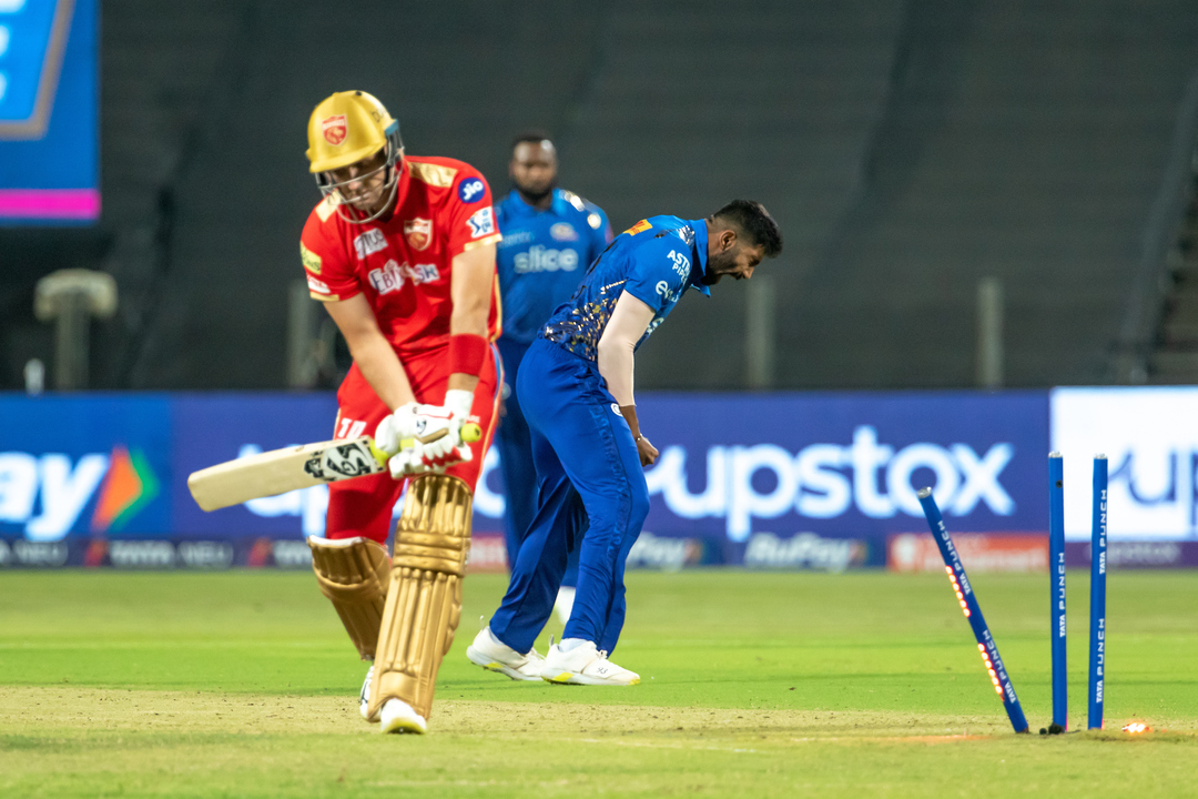 Jasprit Bumrah's perfect yorker to Liam Livingstone background