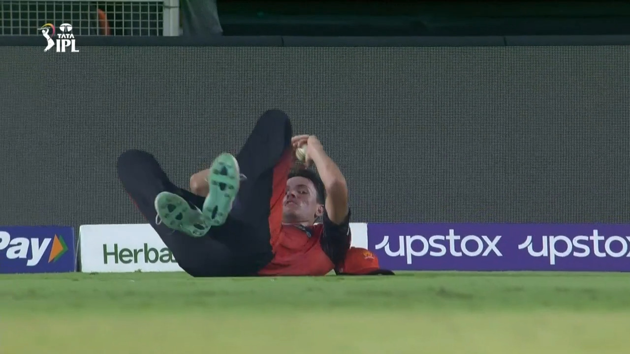 Super grab: Jansen takes a brilliant catch running backwards background