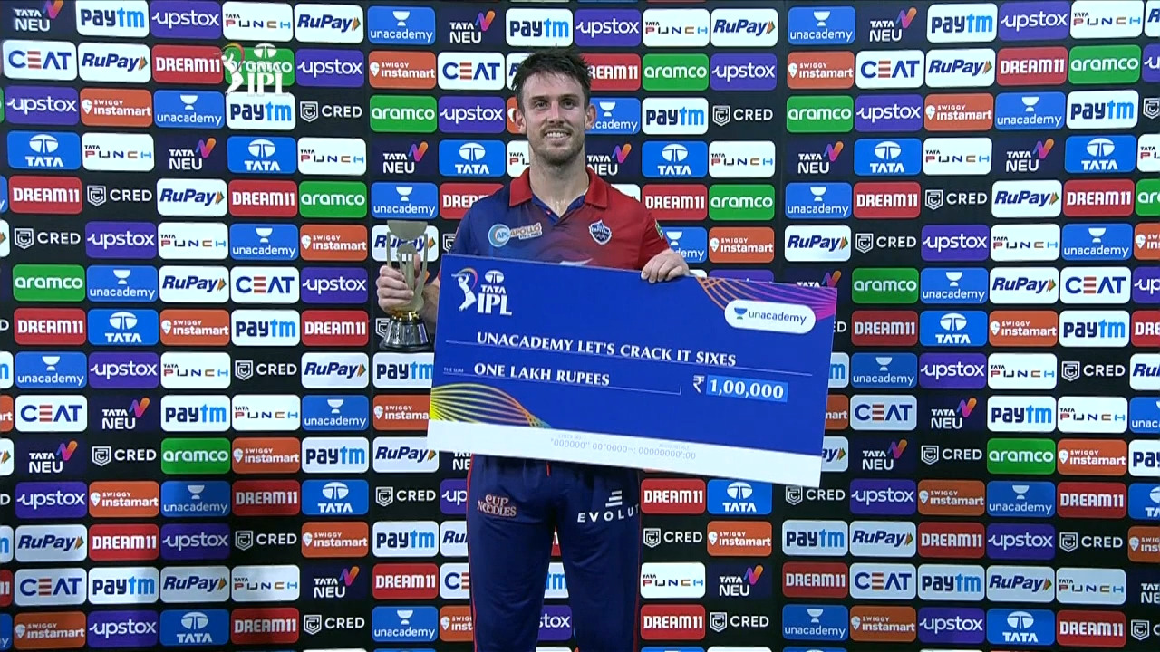 M58: RR vs DC – Unacademy Let's Crack It Sixes of the Match – Mitchell Marsh background