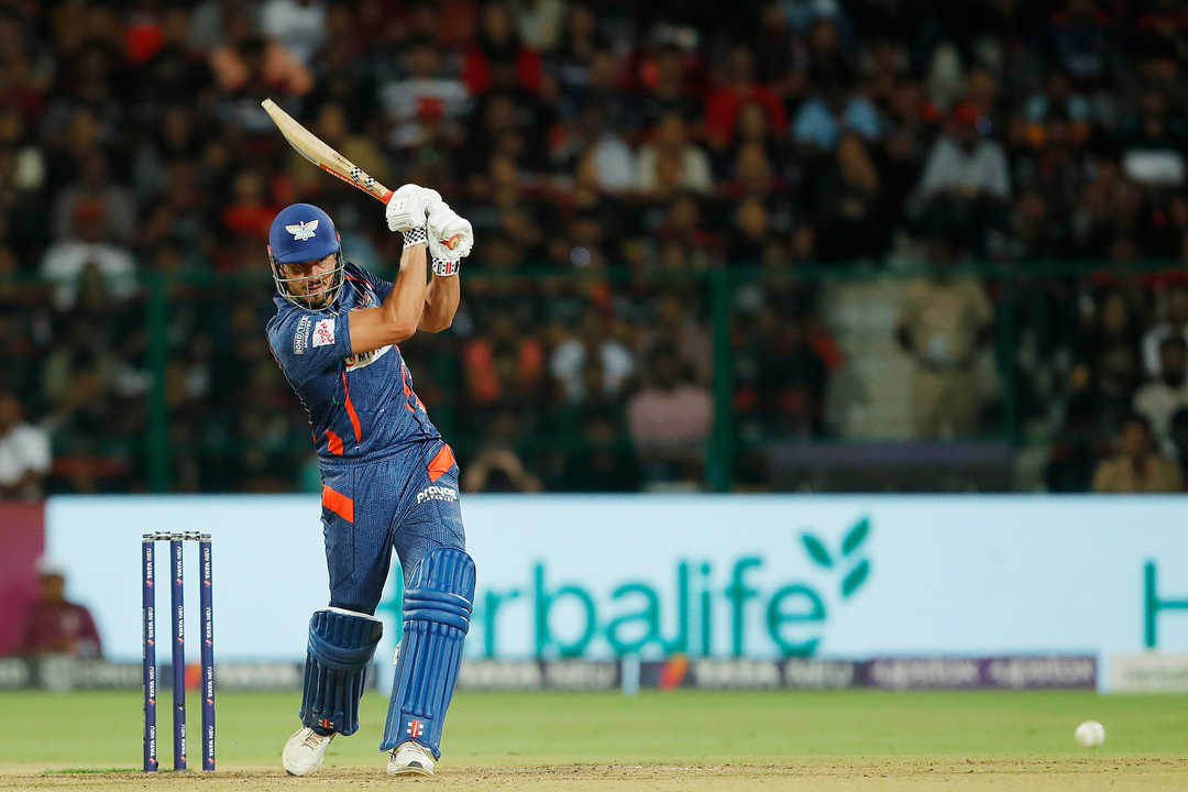 Powerful strikes: Stoinis smashes 6,4,4 off Harshal