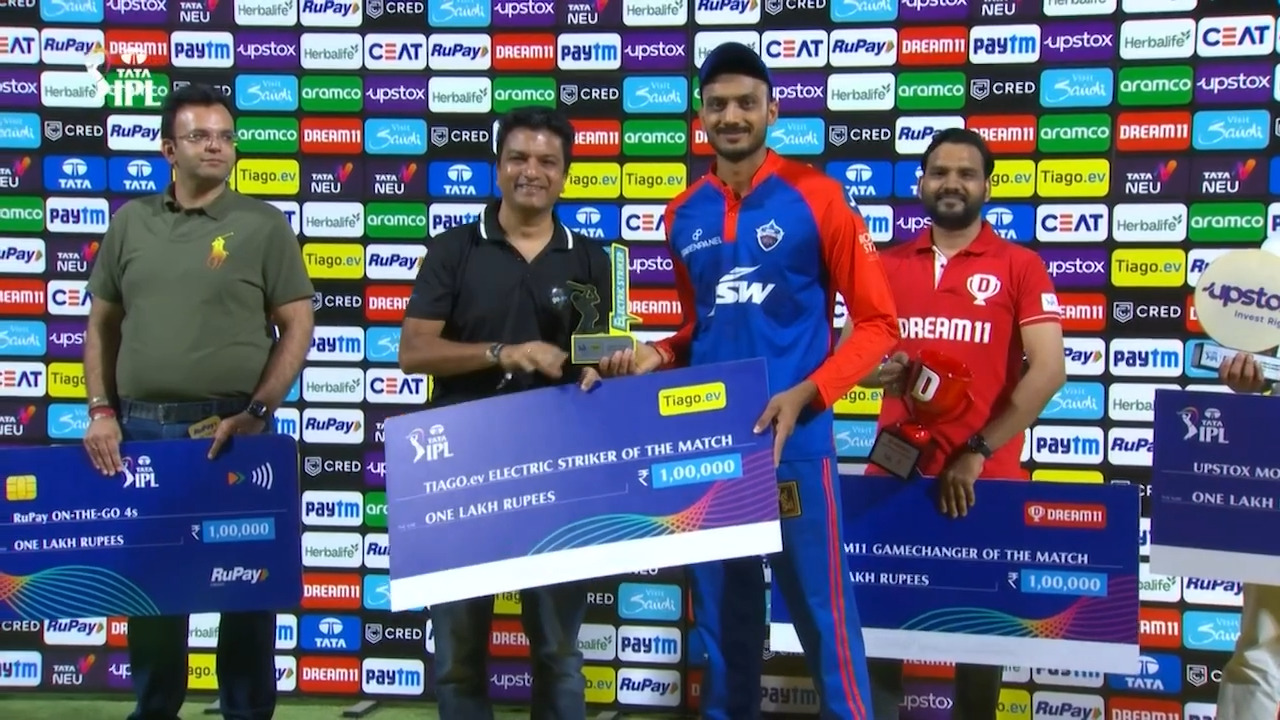 M16: DC vs MI – TIAGO.ev Electric Striker of the Match – Axar Patel backdrop