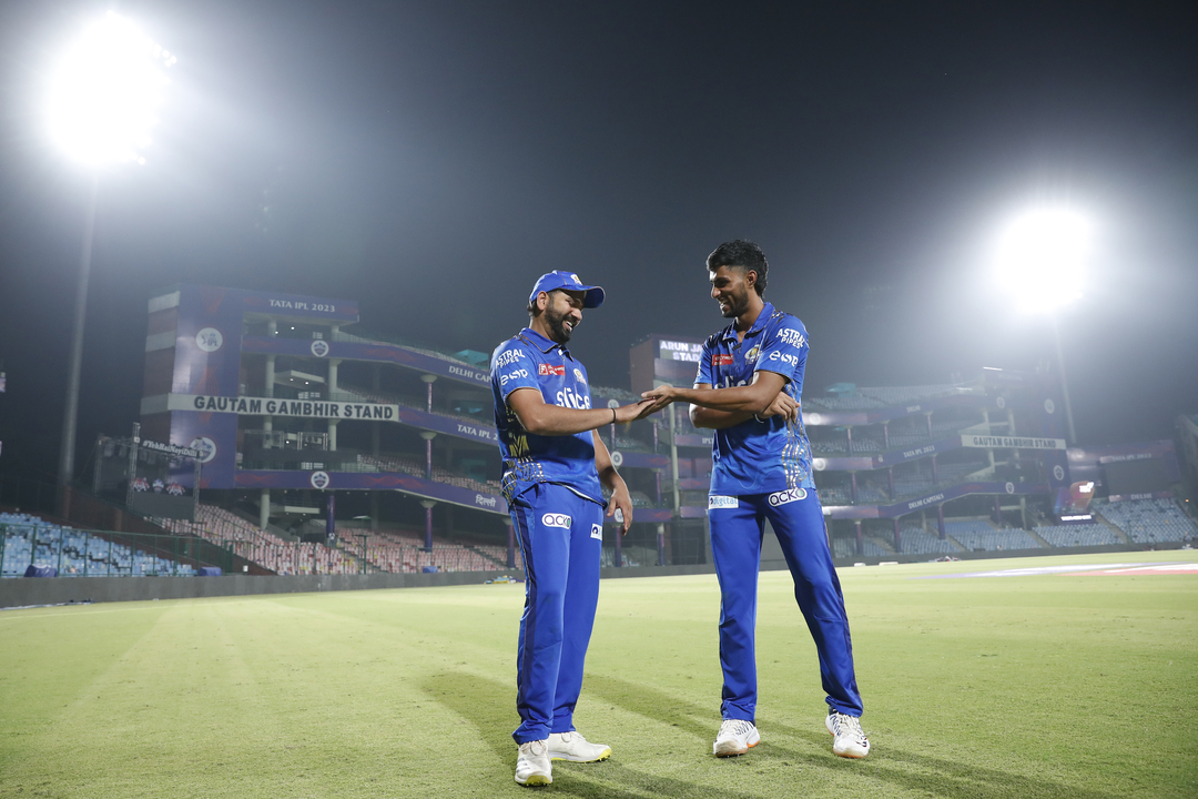 Capping off MI's win with captain Rohit Sharma and Tilak Varma background