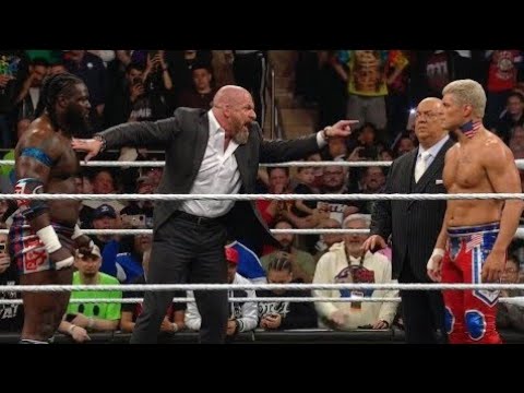 Eventually Oba Femi becomes angry suddenly and Cody Rhodes attacks them brutally background