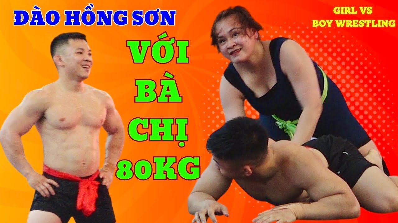 VẬT NAM NỮ-ĐÀO HỒNG SƠN VỚI E TRANG 80 KG.Women wrestling with men at Traditional village festival.