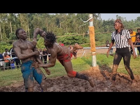 KING OF THE MUD WRESTLING TONAMENT: EAZIE HUZAIFAH VS RIDDLE HEAD BOY background