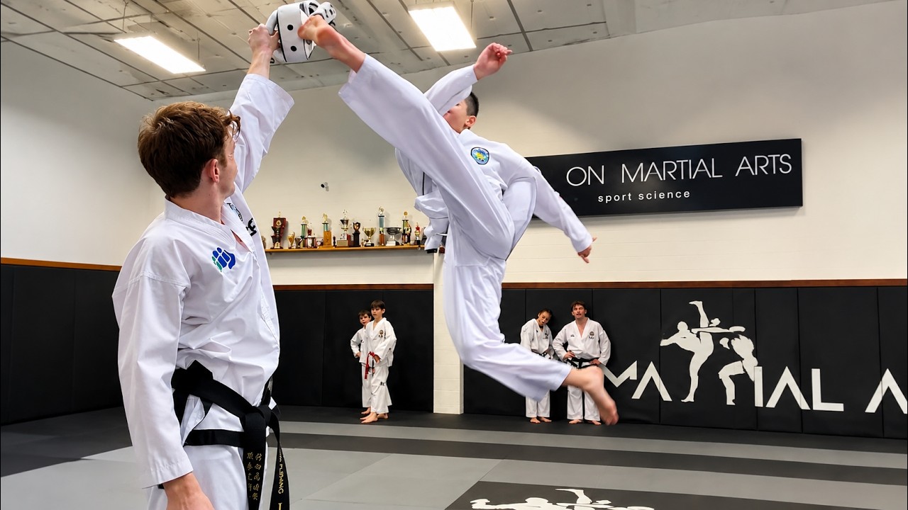 Taekwondo Black Belt Shows Incredible Flying Kick! background