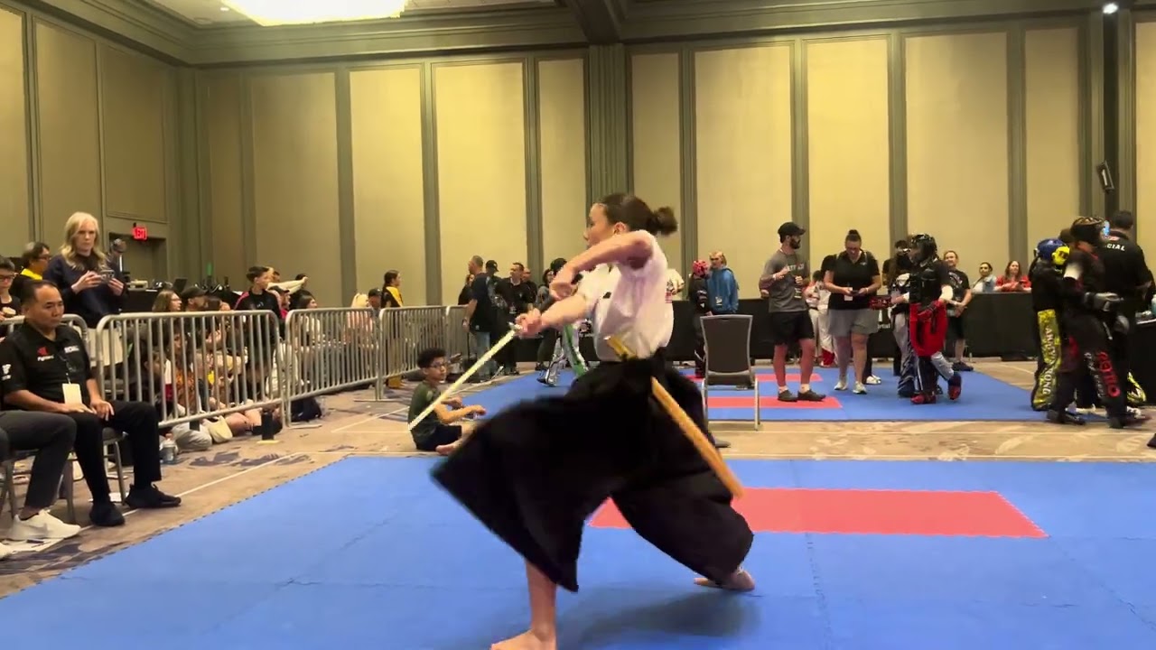 Maddie Wiersma 13 & Under Girls Traditional Weapons Grand Championship background