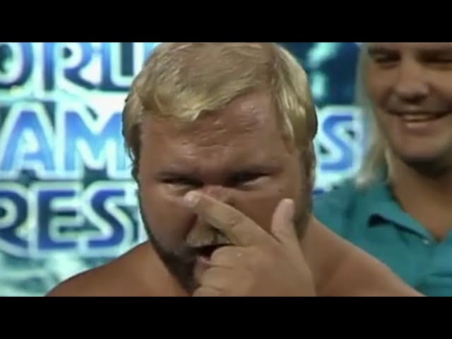 Barry Windham puts The Claw on Dusty Rhodes. NWA 1988 background