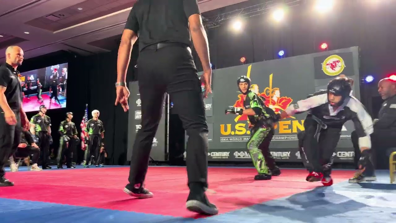 Team Revolution vs. Team Paul Mitchell Mens Team Sparring ISKA World Championship - US Open 2026 backdrop