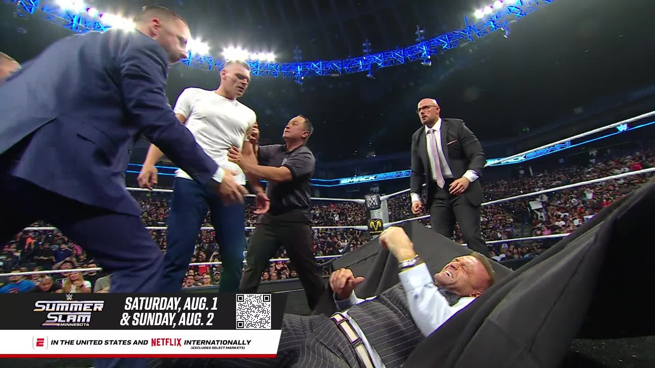 Gunther drives Nick Aldis through a table after Aldis initiates huge brawl: SmackDown highlights background