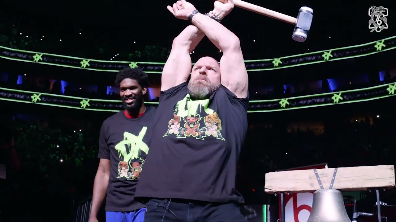 Joel Embiid Walks Out with Triple H to Ring The Bell