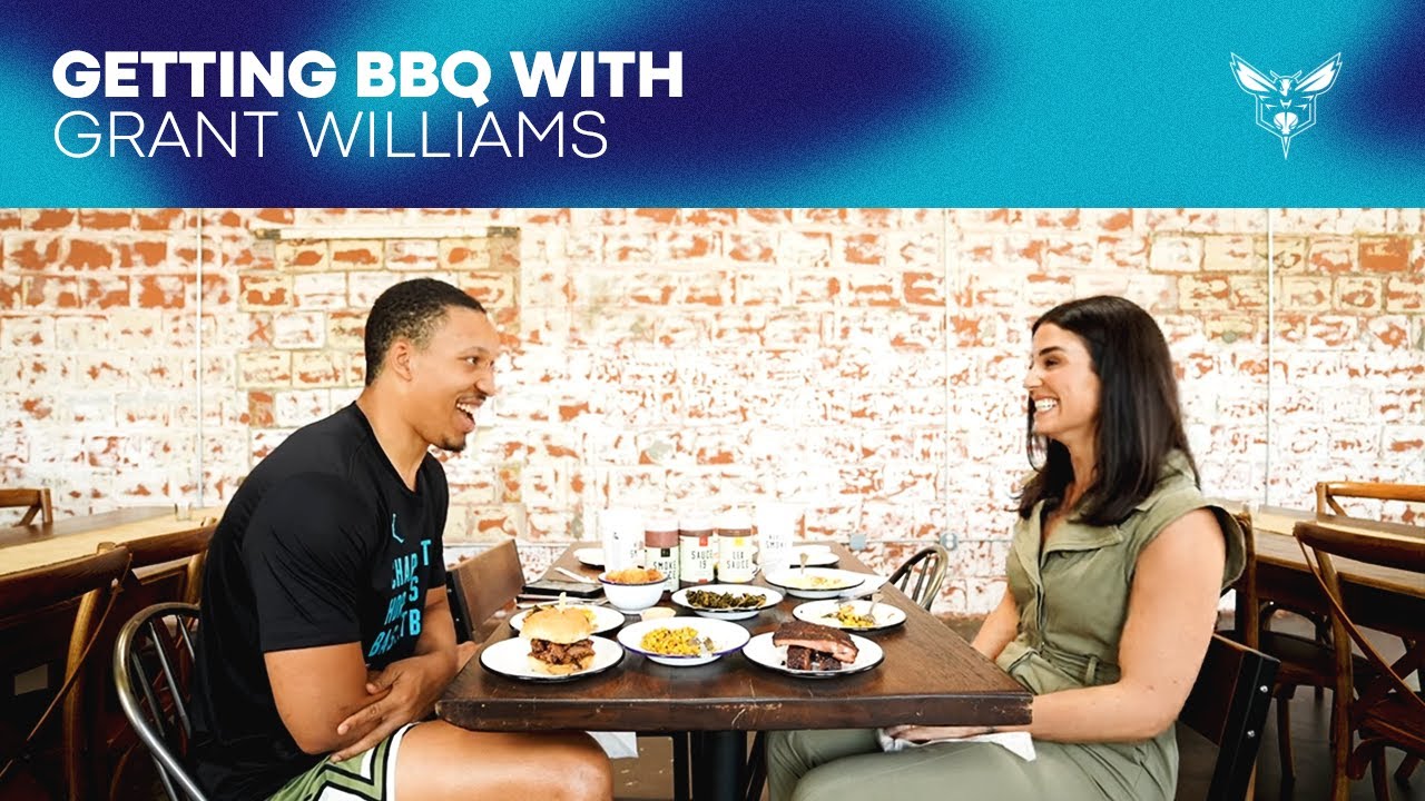 Grant Williams Talks With Ashley ShahAhmadi at a Local BBQ background