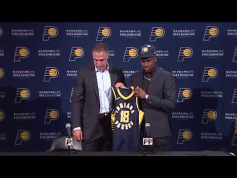 Aaron Holiday's Introductory Press Conference background