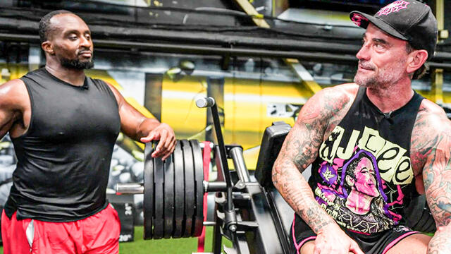 CM Punk trains for Cody Rhodes SummerSlam title match with Big E background