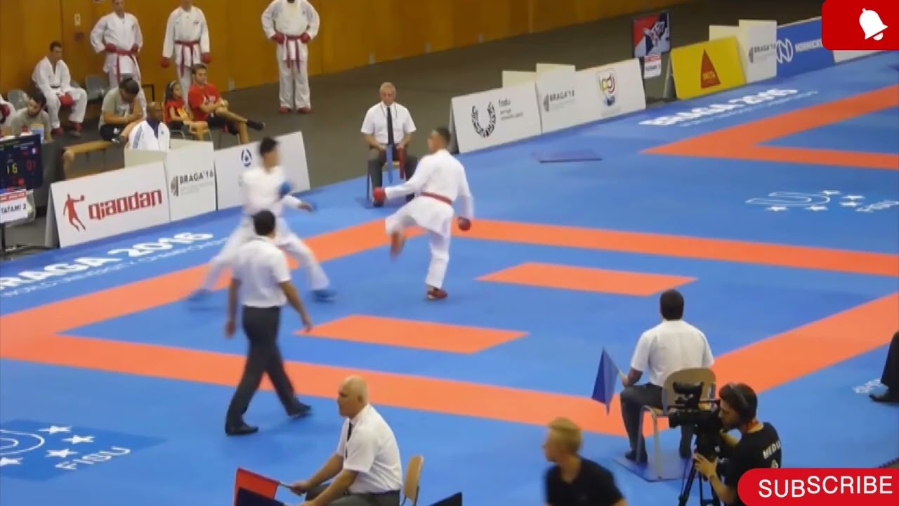 Male Team Kumite Match.. Steven Da Costa French (AKAđŽ) VS Ken Nishimura Japan (AOđ”).. background