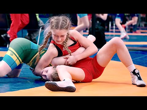 U13 Delisia Pert (EST) vs Inez Lolax (SWE) 40kg. Girls women's youth wrestling tournament. B-cam-man background